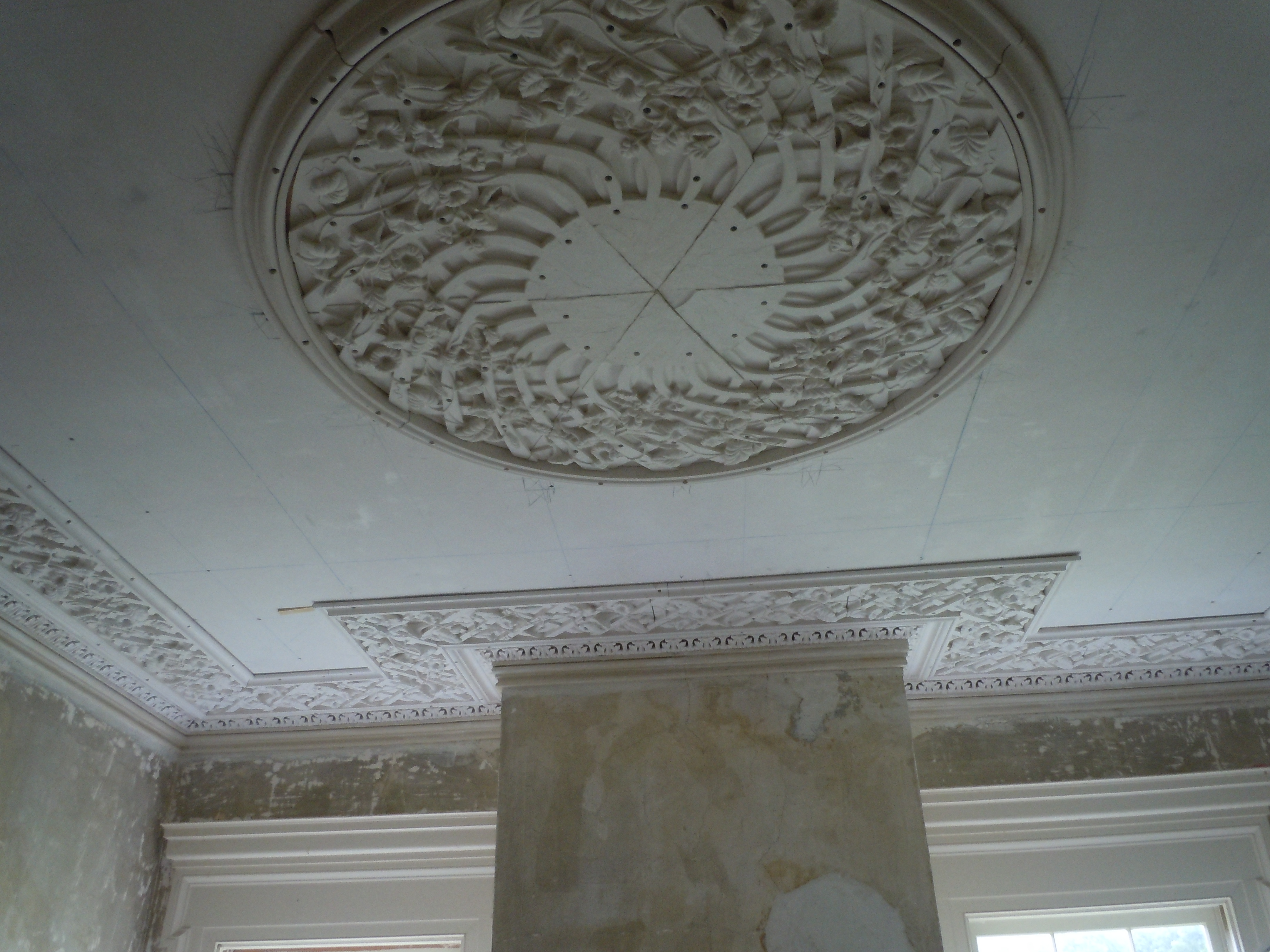 Lattice perimeter and partially installed center medallion in the front room.
