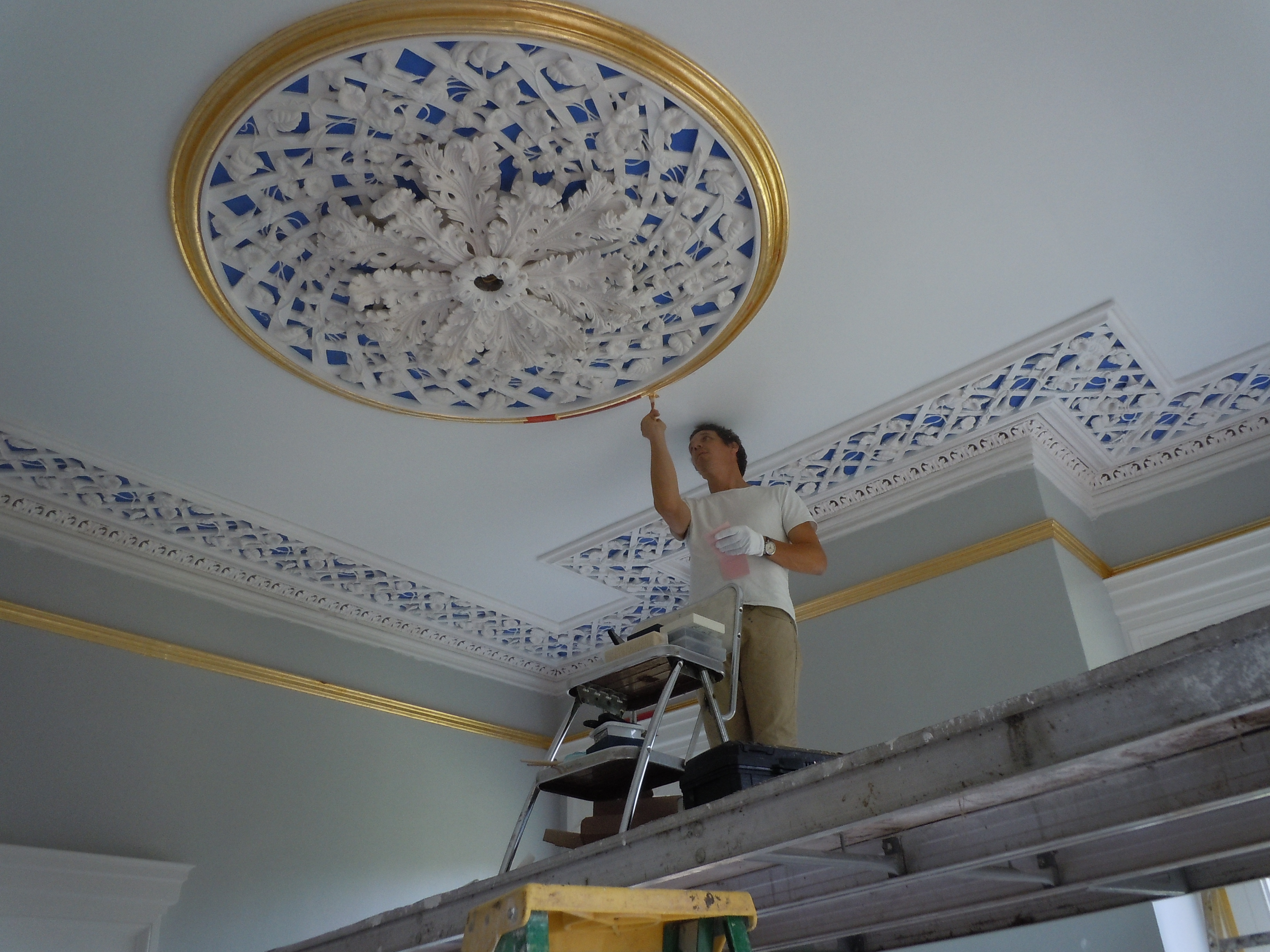  Greg Jacobs gilding the front room ceiling medallion.